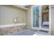 Exterior view of a patio with sliding glass doors leading to a bedroom, offering seamless indoor-outdoor living at 8594 W Quarto Ave, Littleton, CO 80128