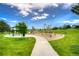 Community playground features a walking path, climbing structure, and lots of green space at 8594 W Quarto Ave, Littleton, CO 80128
