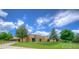 Nearby school showing manicured lawns, a drop-off area, and ample parking at 8594 W Quarto Ave, Littleton, CO 80128