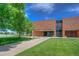 School with manicured lawns, sidewalk entry and plenty of space at 8594 W Quarto Ave, Littleton, CO 80128