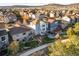 Lovely backyard with deck, patio, playground, and manicured lawn surrounded by neighboring homes at 1271 Sky Rock Way, Castle Rock, CO 80109