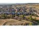 Stunning aerial view of a residential area near a beautiful landscape and trail at 1271 Sky Rock Way, Castle Rock, CO 80109