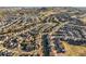 Expansive aerial view of a neighborhood featuring numerous homes, streets, and scenic mountains in the distance at 1271 Sky Rock Way, Castle Rock, CO 80109