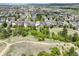 Panoramic aerial showcases the home's location with stunning views and proximity to community amenities at 1271 Sky Rock Way, Castle Rock, CO 80109