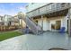 A well designed backyard featuring a deck and a concrete paver patio with a built-in fire pit at 1271 Sky Rock Way, Castle Rock, CO 80109