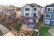 Beautiful home backyard with deck, patio, well-manicured lawn, and tasteful landscaping at 1271 Sky Rock Way, Castle Rock, CO 80109