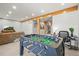Finished basement with game table and desk area, offering versatile space for work and play at 1271 Sky Rock Way, Castle Rock, CO 80109