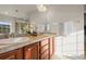 Elegant bathroom with double sinks, tiled countertops, and ample storage space at 1271 Sky Rock Way, Castle Rock, CO 80109