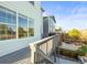 Exterior shot of a deck with stairs leading to a backyard patio and manicured lawn in a well-maintained neighborhood at 1271 Sky Rock Way, Castle Rock, CO 80109