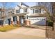 Attractive two-story home with a welcoming front porch, two-car garage, and nice driveway at 1271 Sky Rock Way, Castle Rock, CO 80109