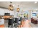 Open-concept kitchen featuring modern white cabinetry, granite countertops, and stainless steel appliances at 1271 Sky Rock Way, Castle Rock, CO 80109