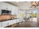 Modern kitchen showcasing granite countertops, stainless steel appliances, and hardwood flooring at 1271 Sky Rock Way, Castle Rock, CO 80109