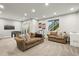 A spacious basement living room includes comfortable seating, and ample lighting, ideal for relaxation and recreation at 1271 Sky Rock Way, Castle Rock, CO 80109