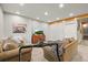 Cozy living room with comfortable seating, artwork, and a view of scenic mountains on the television screen at 1271 Sky Rock Way, Castle Rock, CO 80109