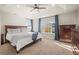 Spacious primary bedroom featuring large windows, tray ceiling, and ample natural light at 1271 Sky Rock Way, Castle Rock, CO 80109