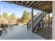 A covered patio area for outdoor entertaining, featuring stone detailing and string lights at 1271 Sky Rock Way, Castle Rock, CO 80109