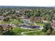 Aerial view of community playground area featuring walking paths and play equipment at 5640 Niagara St, Commerce City, CO 80022