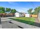 The backyard has a detached garage, storage shed, new sod, and a freshly poured concrete patio for entertaining at 5640 Niagara St, Commerce City, CO 80022