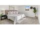 Stylish bedroom featuring soft carpet, decorative headboard, and contemporary decor at 5640 Niagara St, Commerce City, CO 80022