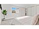 Bright bedroom featuring fresh white walls, plush carpet, and a window with a view at 5640 Niagara St, Commerce City, CO 80022