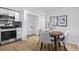 Adjacent to the kitchen, a table and seating for four completes the dining space at 5640 Niagara St, Commerce City, CO 80022