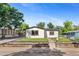 Attractive home with a well-kept lawn, modern accents, and a welcoming front entrance at 5640 Niagara St, Commerce City, CO 80022
