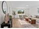 Inviting living room with a serene view, complete with elegant decor and plush seating at 5640 Niagara St, Commerce City, CO 80022