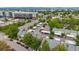Aerial shot of townhomes with carports surrounded by trees and lush landscaping at 1150 Inca St # 43, Denver, CO 80204