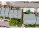 Aerial view of townhomes showcases fenced in patios and shared driveways at 1150 Inca St # 43, Denver, CO 80204