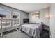 Well-lit bedroom features a desk, television, and windows that provide natural light at 1150 Inca St # 43, Denver, CO 80204