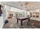 Bright, open billiards room with natural light, stylish decor, and a cozy fireplace at 1150 Inca St # 43, Denver, CO 80204