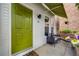 Charming entryway featuring a bright green door, small patio, and awning for shade at 1150 Inca St # 43, Denver, CO 80204