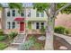 Charming townhome with well-maintained landscaping, colorful awnings, and a welcoming entryway at 1150 Inca St # 43, Denver, CO 80204