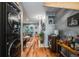 Inviting living room features a stylish bar cart, modern decor, and seamless flow into the adjacent spaces at 1150 Inca St # 43, Denver, CO 80204