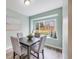 Cozy dining room featuring a large window seat, modern decor, and ample natural light at 15149 E Princeton Pl # D, Aurora, CO 80014