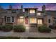 Charming townhome with a mix of brick and siding, complemented by well-manicured bushes, enhancing its curb appeal at 15149 E Princeton Pl # D, Aurora, CO 80014