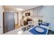 Modern kitchen with granite countertops, stainless steel appliances, and sleek gray cabinetry at 15149 E Princeton Pl # D, Aurora, CO 80014