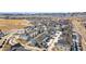 Community aerial view shows modern homes in a well-planned neighborhood with mountain views at 8055 Navajo River Loop # B, Littleton, CO 80125