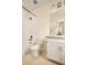 A well-lit bathroom featuring modern fixtures, a shower-tub combo and a white vanity with countertop at 8055 Navajo River Loop # B, Littleton, CO 80125