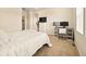 Cozy bedroom with a bed, desk setup, and ample space for relaxation or work at 8055 Navajo River Loop # B, Littleton, CO 80125