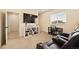 Upstairs bonus room includes theater seating, a workspace, and entertainment options at 8055 Navajo River Loop # B, Littleton, CO 80125
