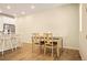Adjacent dining area offers a table set for four, conveniently located next to the kitchen at 8055 Navajo River Loop # B, Littleton, CO 80125