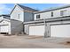 Attached garages with multiple bays and paved driveways offering convenient parking and storage solutions at 8055 Navajo River Loop # B, Littleton, CO 80125