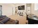 Inviting living room features a media center, neutral carpet, and plenty of natural light at 8055 Navajo River Loop # B, Littleton, CO 80125
