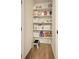 Walk in pantry with white shelves and ample storage space at 8055 Navajo River Loop # B, Littleton, CO 80125