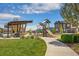 Community playground with modern play equipment and open green spaces at 8055 Navajo River Loop # B, Littleton, CO 80125