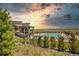 Stunning pool view with mountain backdrop, part of the community amenities at 8055 Navajo River Loop # B, Littleton, CO 80125