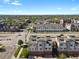 Aerial view of townhomes with solar panels in a residential neighborhood at 8187 Martin Luther King Blvd, Denver, CO 80238