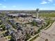 Aerial view of townhomes near commercial area and park at 8187 Martin Luther King Blvd, Denver, CO 80238