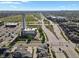 Aerial view of city neighborhood with townhomes with solar panels near commercial buildings at 8187 Martin Luther King Blvd, Denver, CO 80238